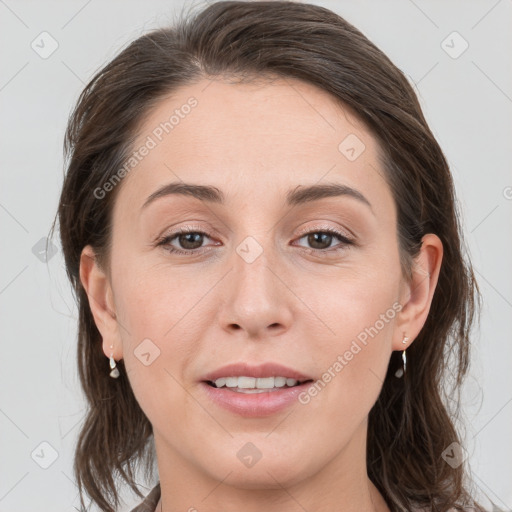 Joyful white young-adult female with medium  brown hair and grey eyes