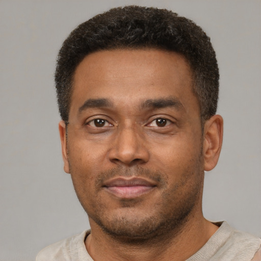Neutral latino adult male with short  brown hair and brown eyes