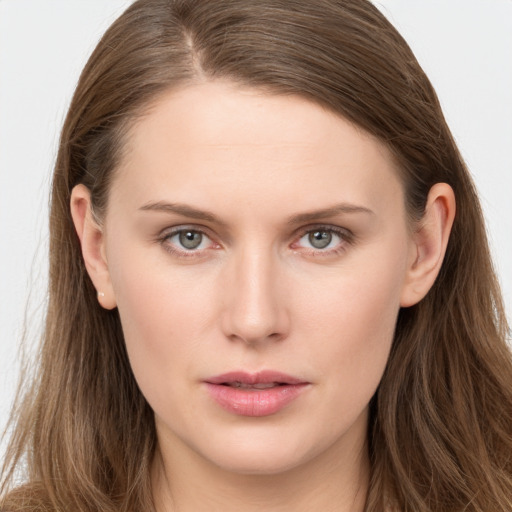 Neutral white young-adult female with long  brown hair and brown eyes