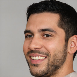 Joyful white young-adult male with short  black hair and brown eyes