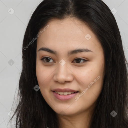 Joyful asian young-adult female with long  brown hair and brown eyes