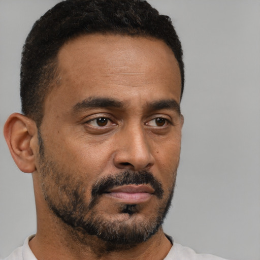 Neutral black young-adult male with short  brown hair and brown eyes