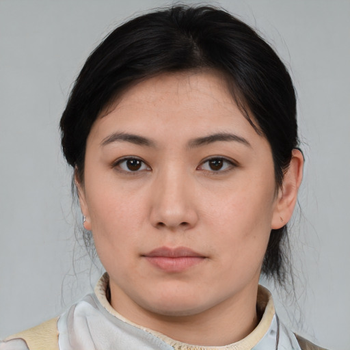 Neutral asian young-adult female with medium  brown hair and brown eyes