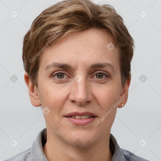 Joyful white adult female with short  brown hair and grey eyes