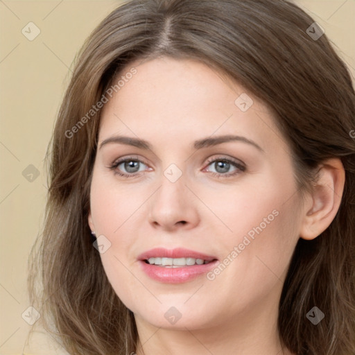 Joyful white young-adult female with long  brown hair and green eyes