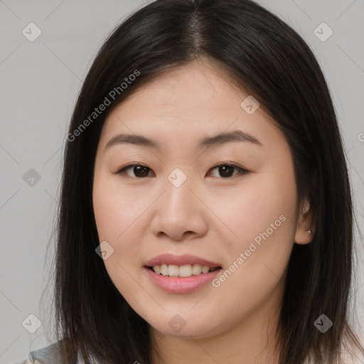 Joyful asian young-adult female with long  brown hair and brown eyes