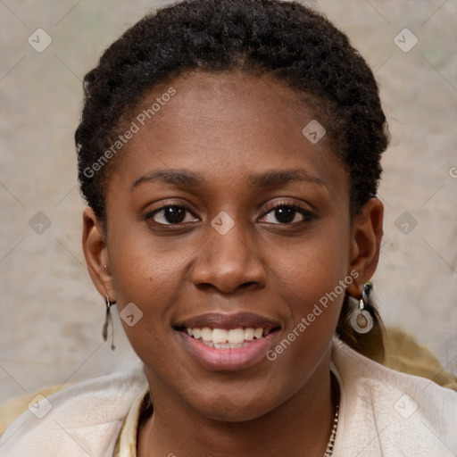 Joyful black young-adult female with short  brown hair and brown eyes