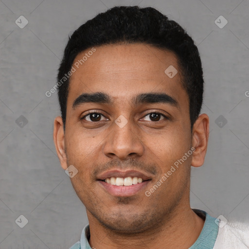 Joyful latino young-adult male with short  black hair and brown eyes
