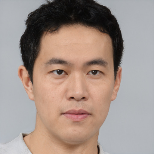 Neutral asian young-adult male with short  brown hair and brown eyes