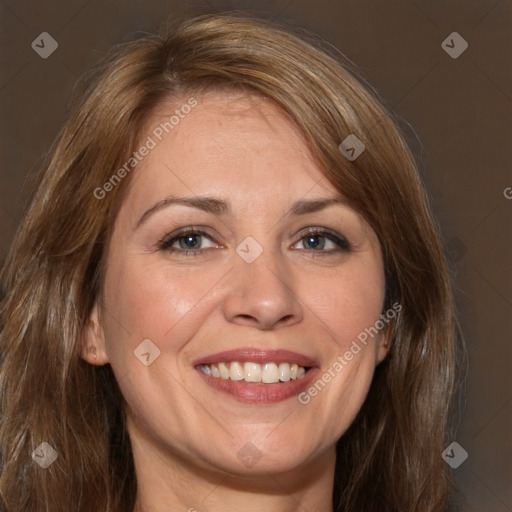 Joyful white adult female with long  brown hair and brown eyes