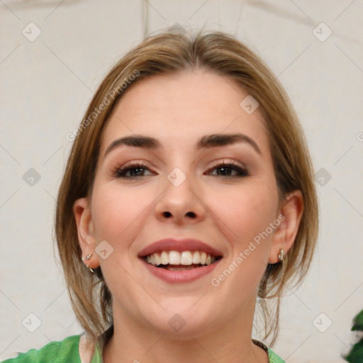 Joyful white young-adult female with medium  brown hair and green eyes