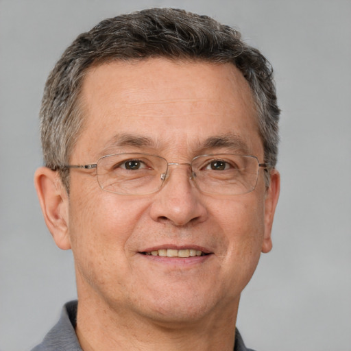 Joyful white middle-aged male with short  brown hair and brown eyes