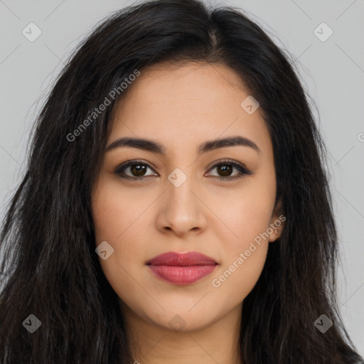 Joyful latino young-adult female with long  brown hair and brown eyes