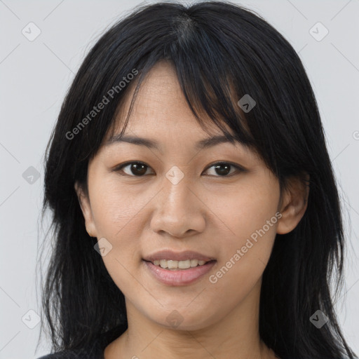 Joyful asian young-adult female with medium  brown hair and brown eyes