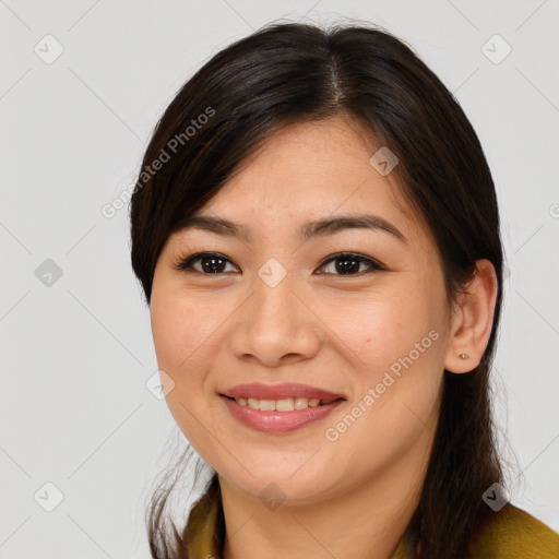 Joyful asian young-adult female with medium  brown hair and brown eyes