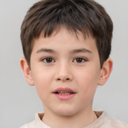 Joyful white child male with short  brown hair and brown eyes