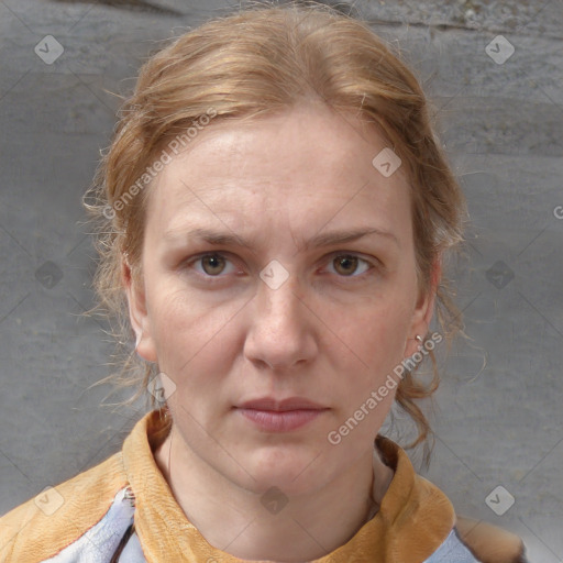 Joyful white adult female with medium  brown hair and blue eyes