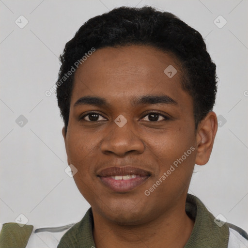 Joyful black young-adult male with short  black hair and brown eyes
