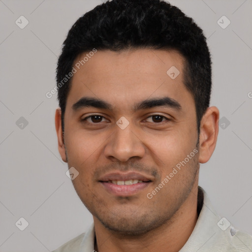 Joyful latino young-adult male with short  black hair and brown eyes