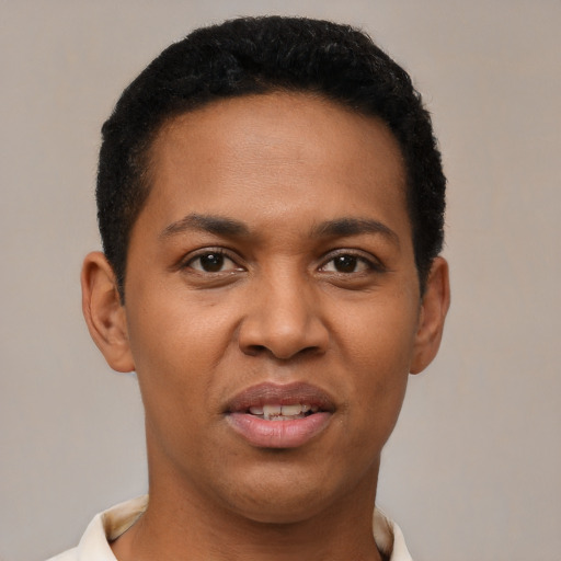 Joyful black young-adult male with short  black hair and brown eyes