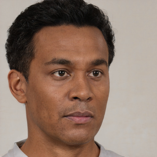 Neutral black young-adult male with short  brown hair and brown eyes