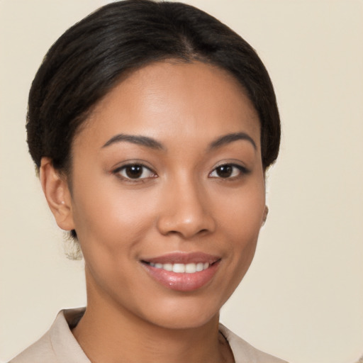 Joyful latino young-adult female with short  brown hair and brown eyes