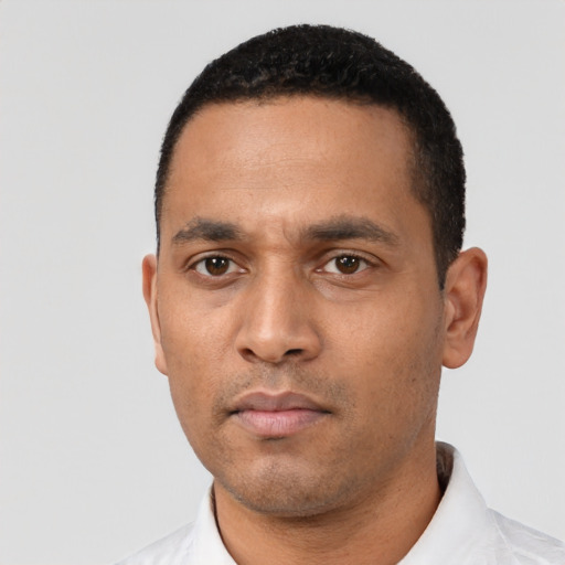 Neutral latino young-adult male with short  black hair and brown eyes