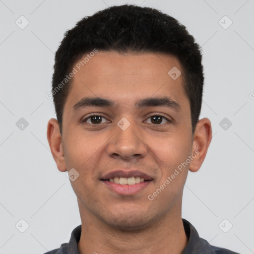 Joyful white young-adult male with short  black hair and brown eyes