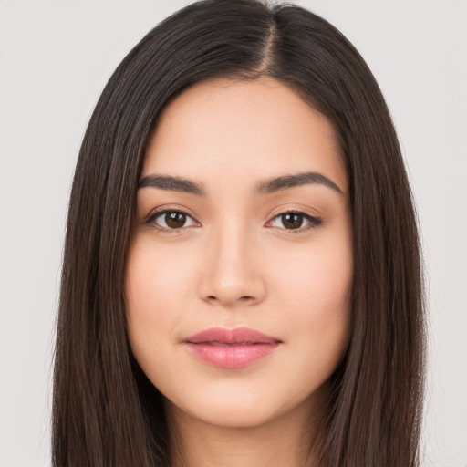 Joyful asian young-adult female with long  brown hair and brown eyes