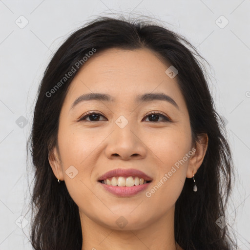 Joyful asian young-adult female with long  brown hair and brown eyes