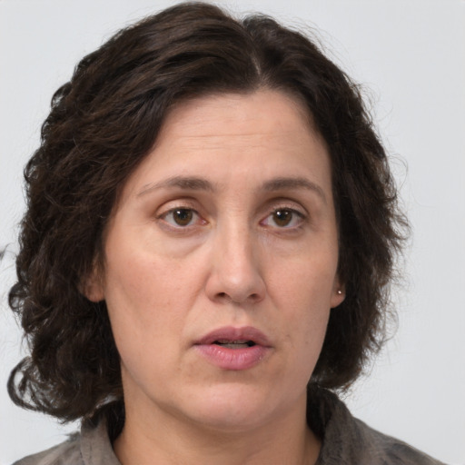 Neutral white adult female with medium  brown hair and brown eyes