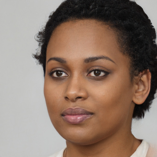 Neutral black young-adult female with long  brown hair and brown eyes