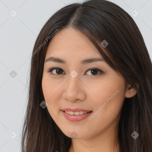 Joyful asian young-adult female with long  brown hair and brown eyes