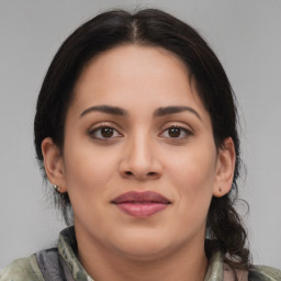 Joyful latino young-adult female with medium  brown hair and brown eyes