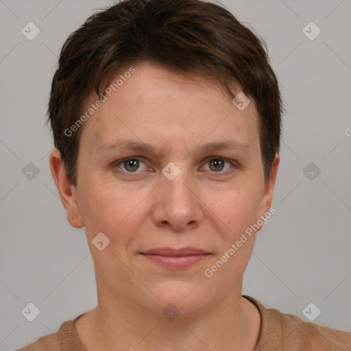 Joyful white adult female with short  brown hair and brown eyes