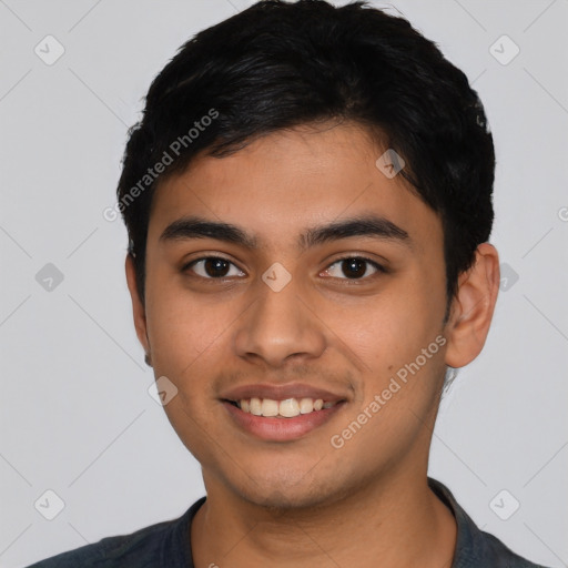 Joyful latino young-adult male with short  black hair and brown eyes