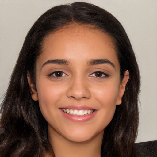 Joyful latino young-adult female with long  black hair and brown eyes