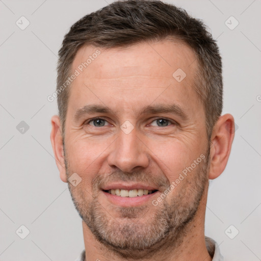 Joyful white adult male with short  brown hair and brown eyes