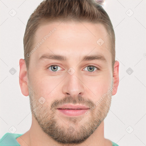 Joyful white young-adult male with short  brown hair and grey eyes