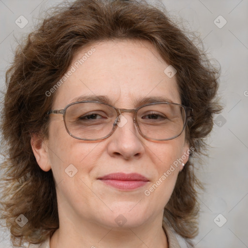 Joyful white adult female with medium  brown hair and blue eyes