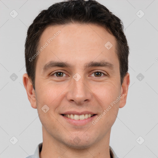 Joyful white young-adult male with short  brown hair and brown eyes