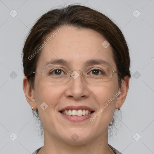 Joyful white adult female with medium  brown hair and grey eyes