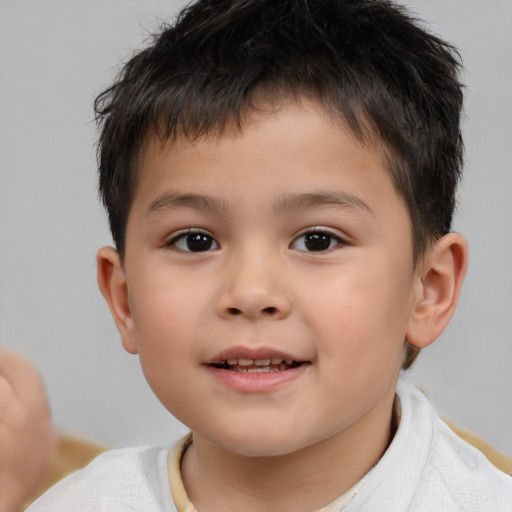 Joyful white child male with short  brown hair and brown eyes