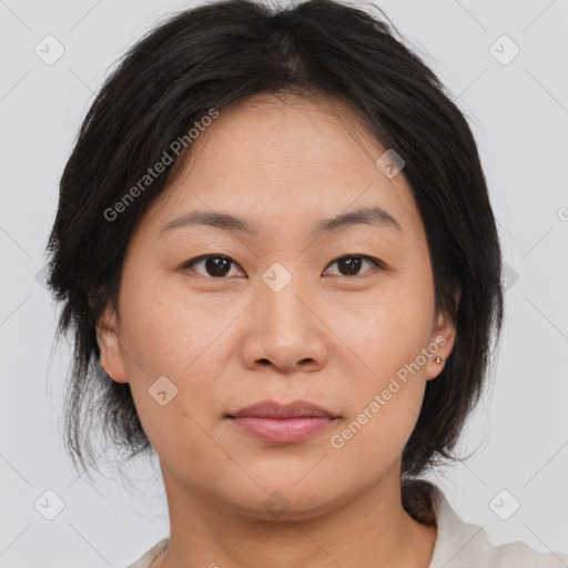 Joyful asian young-adult female with medium  brown hair and brown eyes