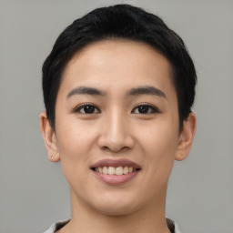 Joyful asian young-adult female with short  black hair and brown eyes