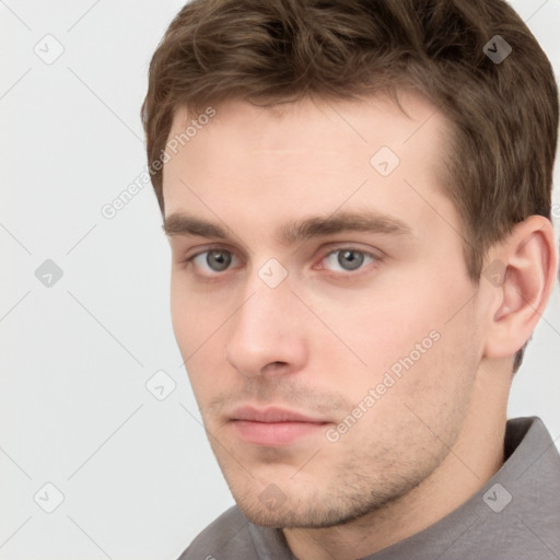 Neutral white young-adult male with short  brown hair and grey eyes