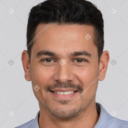 Joyful white young-adult male with short  black hair and brown eyes