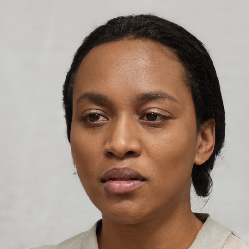 Neutral black young-adult female with short  black hair and brown eyes