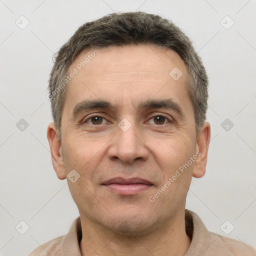 Joyful white adult male with short  brown hair and brown eyes