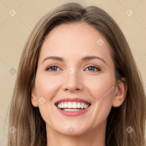 Joyful white young-adult female with long  brown hair and grey eyes